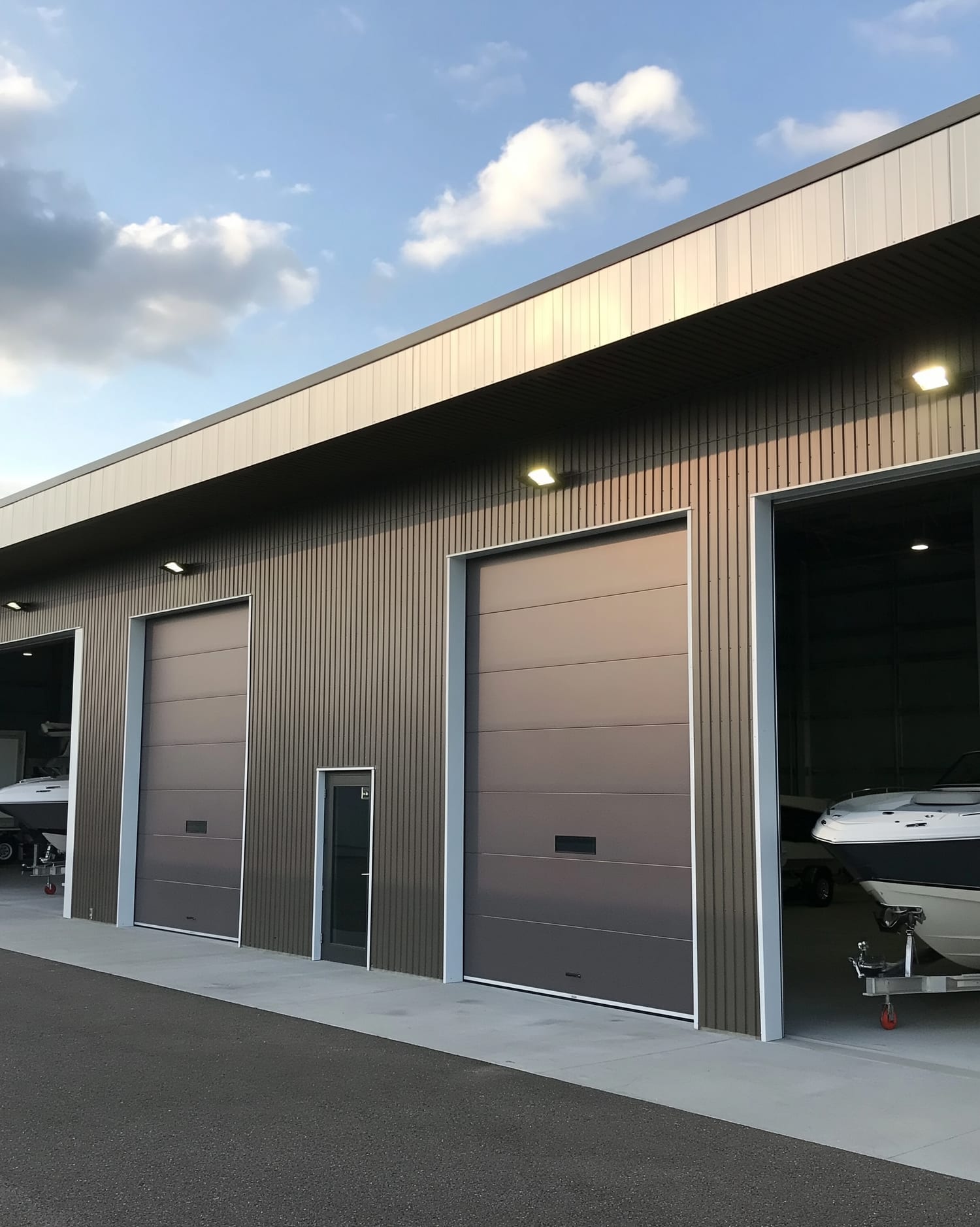Modern Gold Key Boathouse storage units with roll-up doors and boats inside