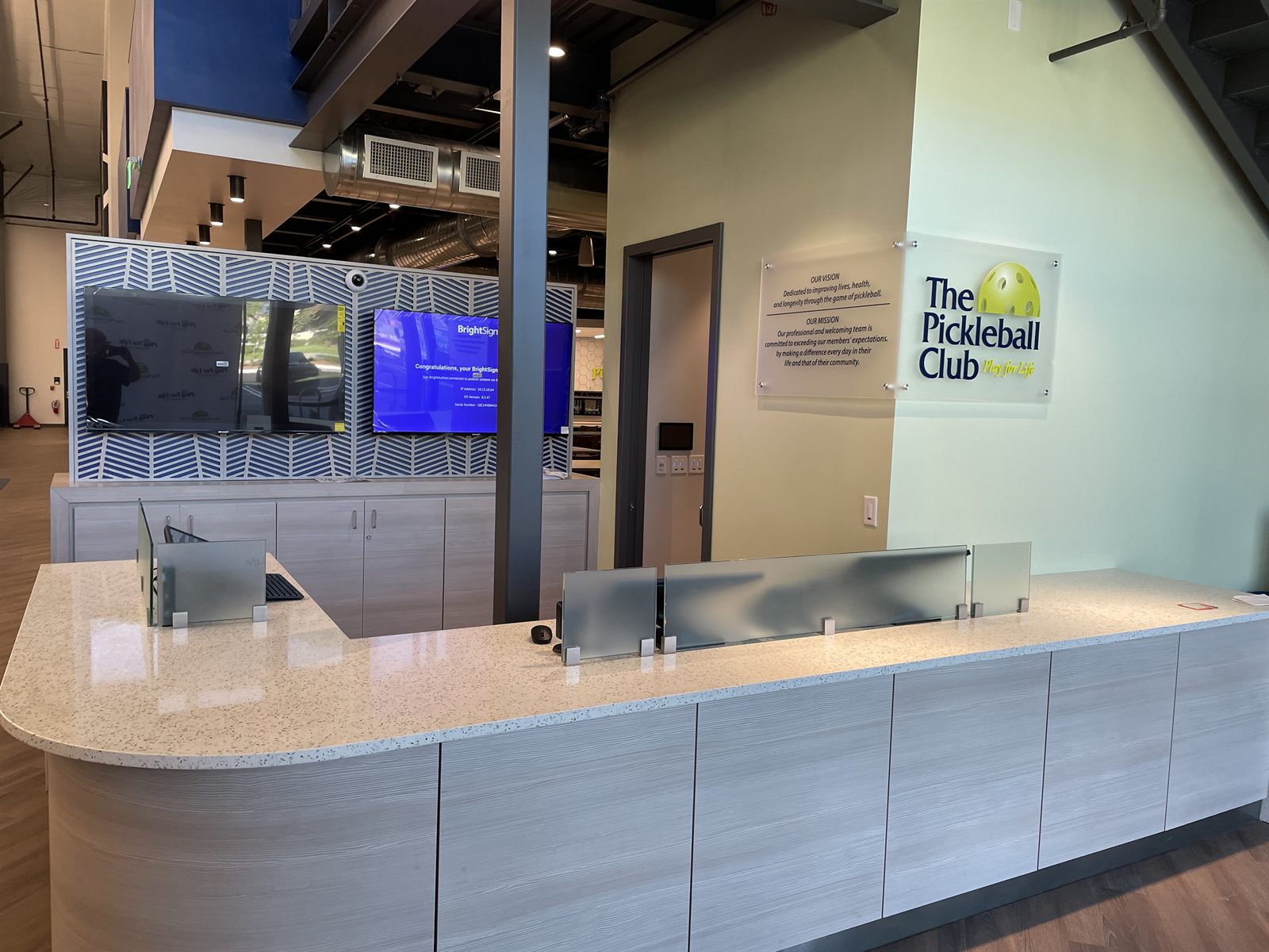 The Pickleball Club reception desk and member entry